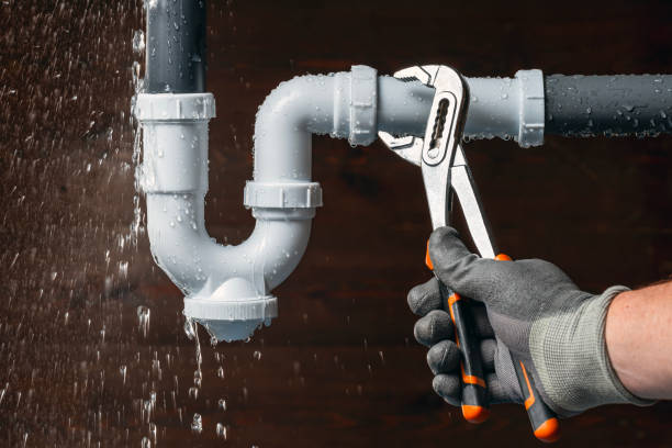 Licensed plumber repairing leaking sink drain pop for residential plumbing service